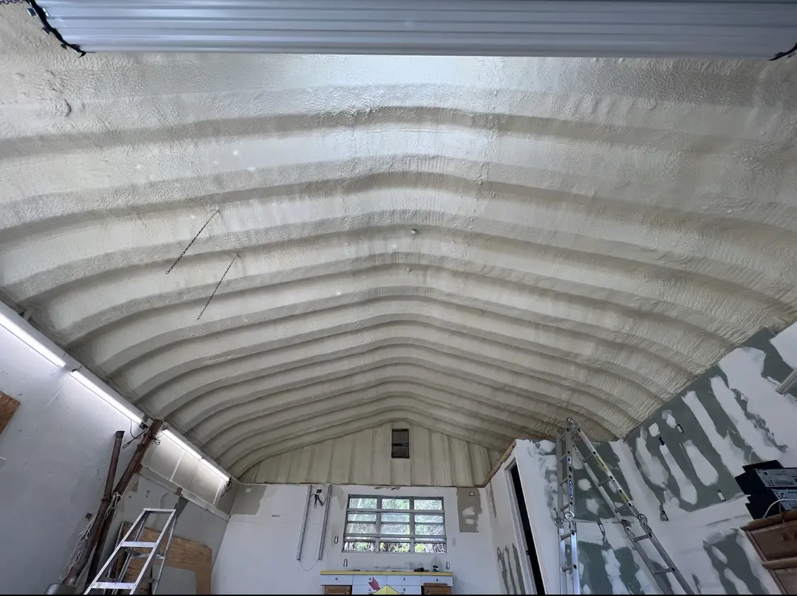 Spray polyurethane foam applied to the underside of a metal roof deck in Van Buren